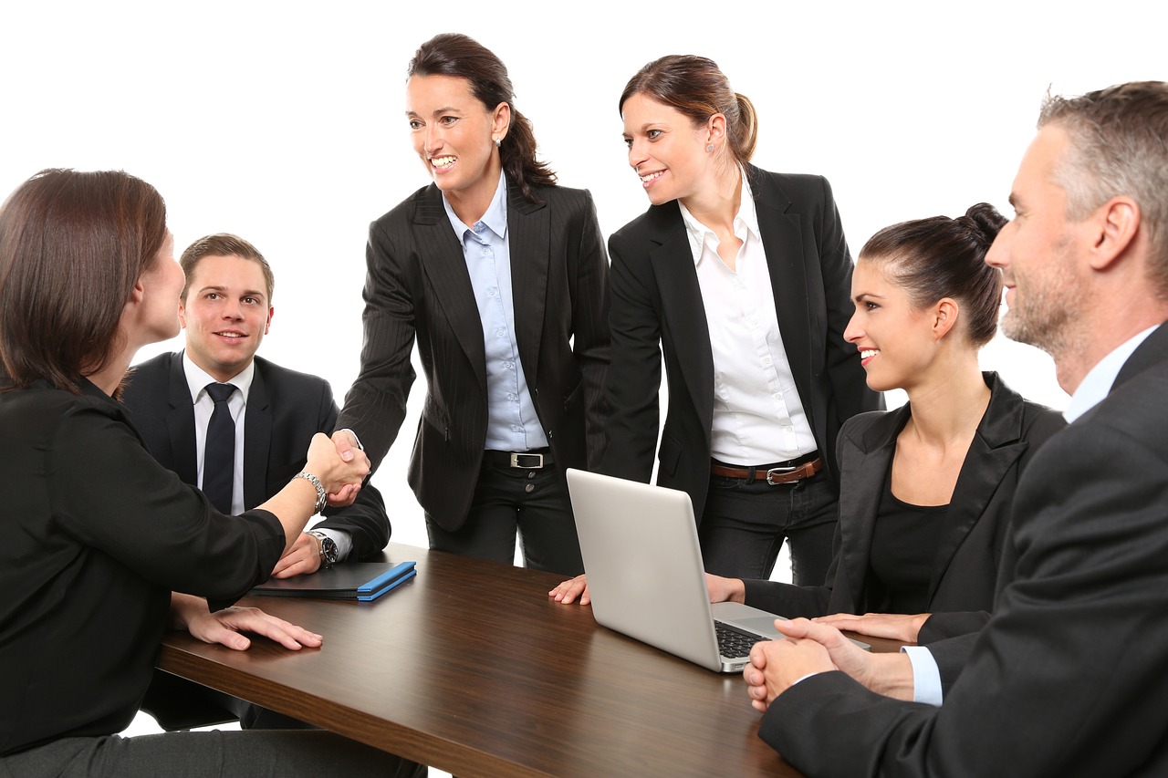Group of happy business people working together
