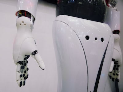 Advanced white robot with blue lighting representing AI-powered content generation and automation systems