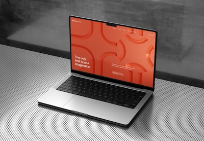 Modern laptop displaying responsive author website design with clean typography and book showcase